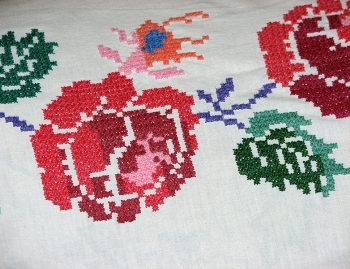 Featured is a photo of a piece of floral-themed cross-stitch ... photo and cross stitch by "Loyna".